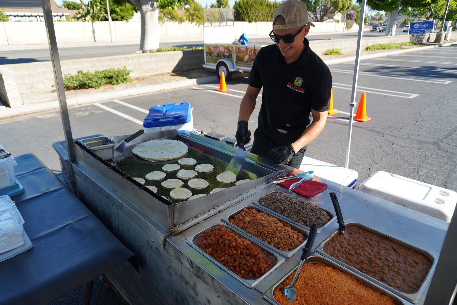 Tortillas warming in a row on the griddle