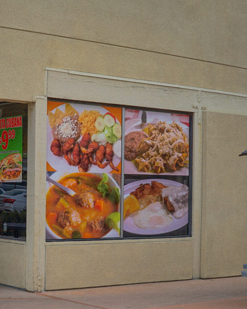 Our storefront window in Placentia, with photos of plates from the menu